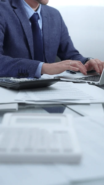businessman wearing blue suit working 600nw 2592384721.jpg